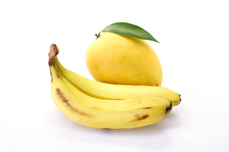 Mango and banana on whiteの写真素材