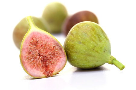 Fig with slice isolated on whtie background