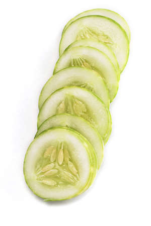 Sliced Cucumber in Stack isolated on whiteの写真素材