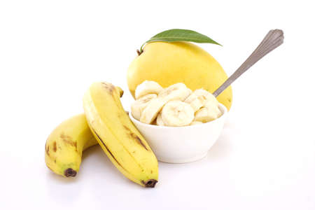 Fresh manago and bananas on whiteの写真素材