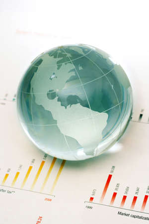 Glass globe and business papers の写真素材