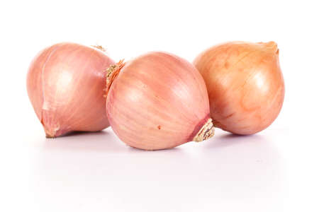 Fresh onion bulbs isolated on white backgroundの写真素材