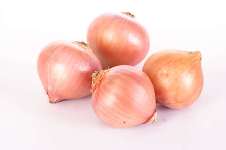 Fresh onion bulbs isolated on white backgroundの写真素材