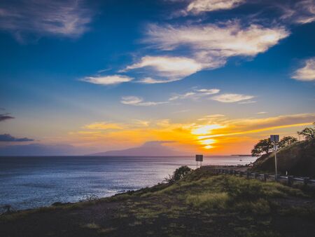 Colorful coastal sunset at Whale Lookout Point on the coast of Maui, Hawaiiの写真素材