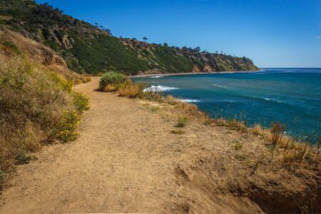 Winding trail along the rugged Pacific coast cliffs in Palos Verdes Estates, Californiaの写真素材