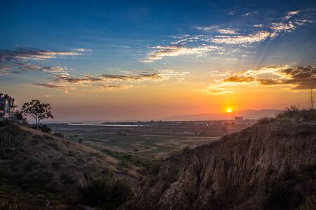 Dynamic sunset over the Ballona Wetlands from a scenic viewpoint on the Bluff Trail, Los Angeles, Californiaの写真素材