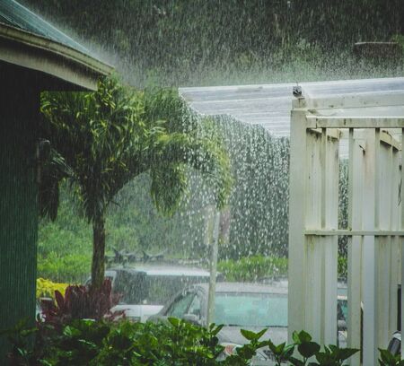 Beautiful heavy tropical rain storm on the island of Kauai in Princeville, Hawaiiの写真素材