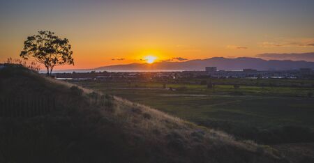 Dynamic sunset over the Ballona Wetlands from a scenic viewpoint on the Bluff Trail, Los Angeles, Californiaの写真素材