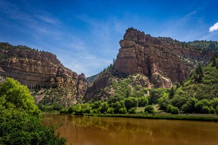 Brown-colored Colorado River flowing through Glenwood Canyon near Hanging Lake, White River National Forest, Glenwood Springs, Coloradoの写真素材