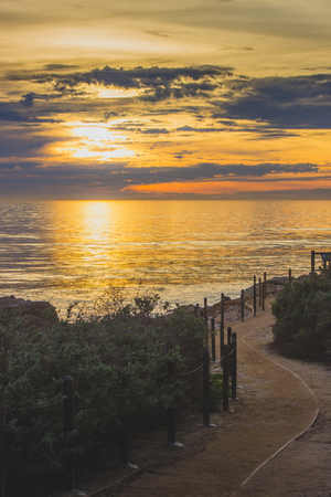 Breathtaking coastal view of a sunset with clouds in the sky from Terranea Tail, Rancho Palos Verdes, Californiaの写真素材