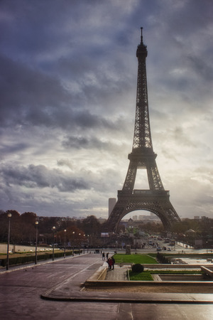 Stunning view of iconic Eiffel Tower from TrocadÃ©ro Gardens on a cloudy autumn day with dramatic sky, Paris, Franceの写真素材