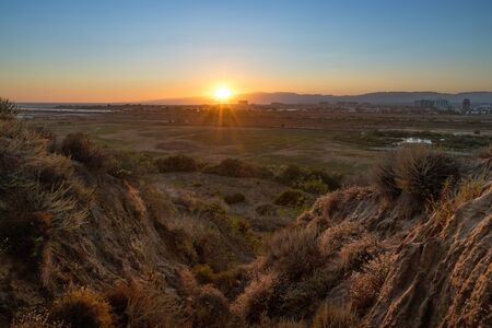 Beautiful sunset over the Ballona Wetlands from a scenic viewpoint on the Bluff Trail, Los Angeles, Californiaの写真素材