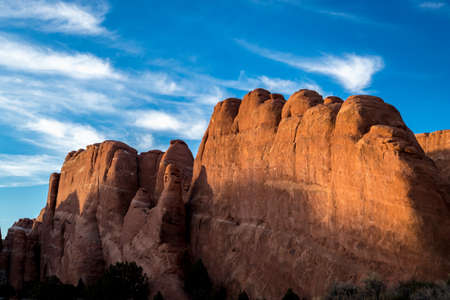 Shadows casting across various sandstone rock formations seen along Arches Scenic Drive, Arches National Park, Moab, Utahの写真素材