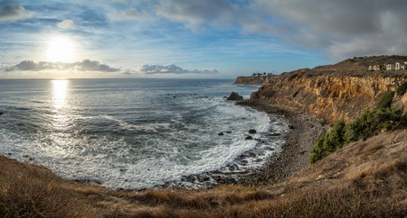 Gorgeous coastline view of Point Vicente and Pelican Cove at sunset with colorful clouds in the sky, Terranea Trail, Rancho Palos Verdes, Californiaの写真素材