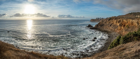Gorgeous coastline view of Point Vicente and Pelican Cove at sunset with colorful clouds in the sky,...