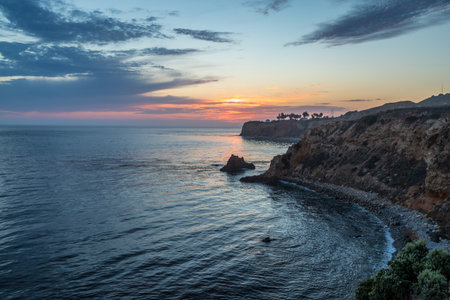 Breathtaking coastline view of Point Vicente and Pelican Cove after sunset with colorful clouds in the sky, Terranea Trail, Rancho Palos Verdes, Californiaの写真素材