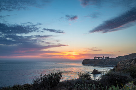 Breathtaking coastline view of Point Vicente and Pelican Cove at sunset with colorful clouds in the sky, Terranea Trail, Rancho Palos Verdes, Californiaの写真素材