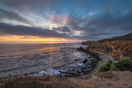 Gorgeous coastline view of Point Vicente and Pelican Cove at sunset with colorful clouds in the sky, Terranea Trail, Rancho Palos Verdes, Californiaの写真素材