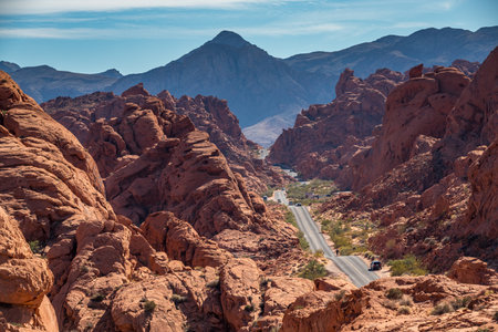Mouse's Tank Road winds through the vibrant red sandstone formations of Valley of Fire State Park, Nevada.の写真素材