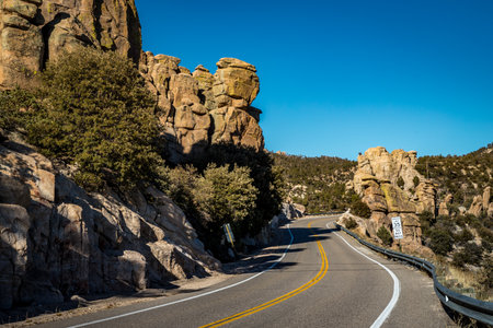 Explore the winding roads of Coronado National Forest, surrounded by majestic rock formations and beautiful desert landscapes in Arizona.の写真素材