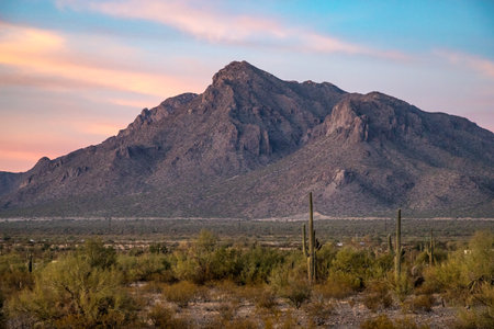 Newman Peak in Arizona during golden hour, surrounded by stunning desert landscapes and majestic mountains.の写真素材