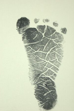 Newborn Footprint on Beigeの写真素材