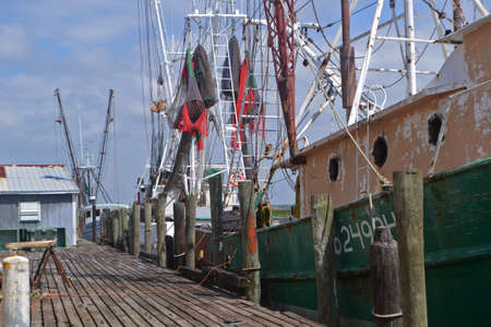 large shrimp boats at wooden dock.jpgの写真素材