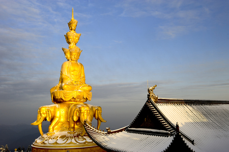 Golden Buddhism statue at the temple of Emei Mountainの写真素材