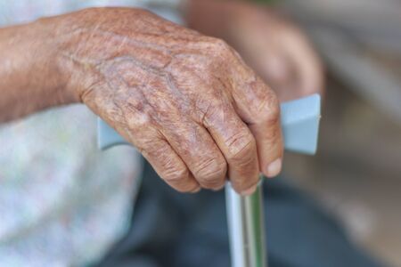 Closeup old hand with crutchの写真素材