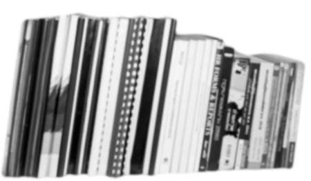 Bookshelves with black and white background blurredの写真素材