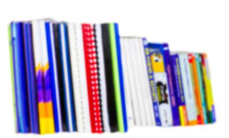 Bookshelves with color cover on white background blurredの写真素材