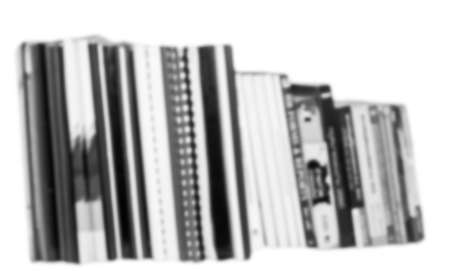 Bookshelves with black and white background blurredの写真素材