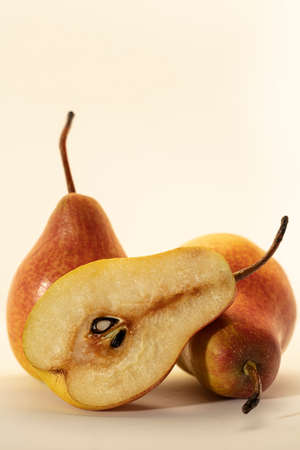 Isolated pears. Cut green and yellow pear fruits isolated on white backgroundの写真素材