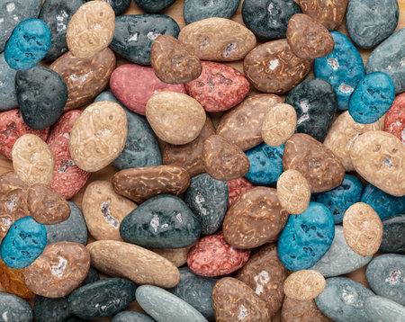 Colorful chocolate candy stones on white background