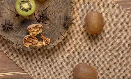 Kiwi on a wooden backgroundの写真素材