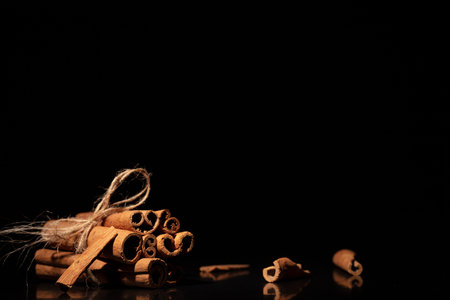 Cinnamon sticks isolated on black