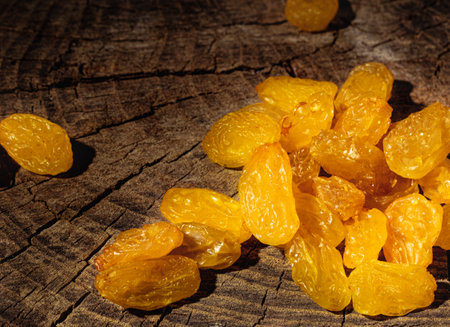 Raisins on dark wooden backgroundの写真素材