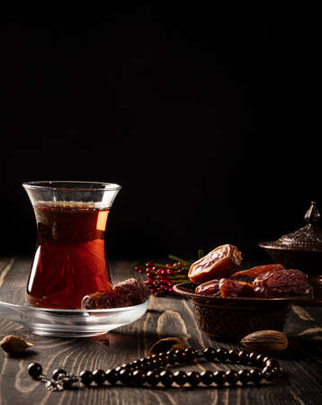 Ramadan concept with a cup of tea and datesの写真素材