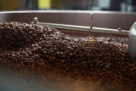 Roasted coffee beans in the mixer (Close-up)の写真素材