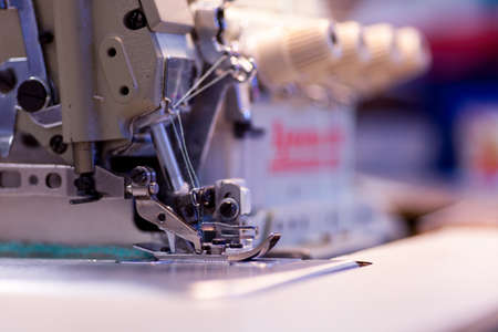 Close shot of an industrial sewing machineの写真素材