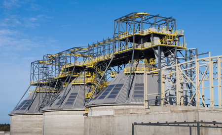 Roof metal constructions with solar collectors on reinforced concrete storages.