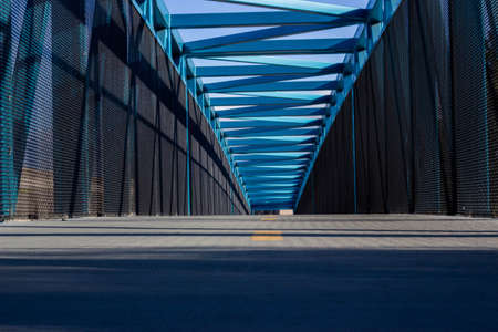 Blue fenced bridgeの写真素材
