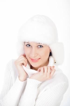 Portrait of the beautiful, smiling young girl  Studio, a close up on a white background の写真素材