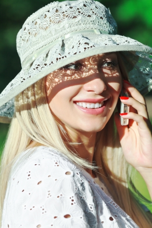 A beautiful young woman on a cell phone の写真素材