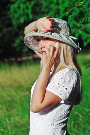 A beautiful young woman on a cell phone の写真素材
