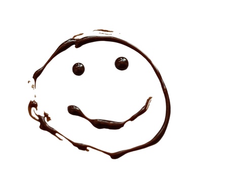 Smiley painted chocolate on white backgroundの写真素材