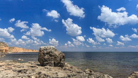 stone on a background of the bay and the cloudy skyの写真素材