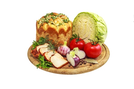 Still life of vegetables with bread on a white backgroundの写真素材