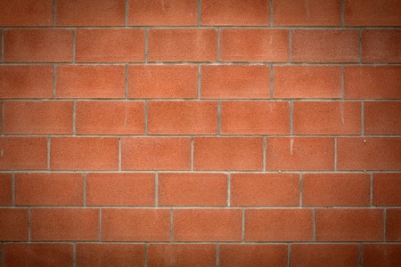 Abstract brick red wall. Vignetting at the edgesの写真素材