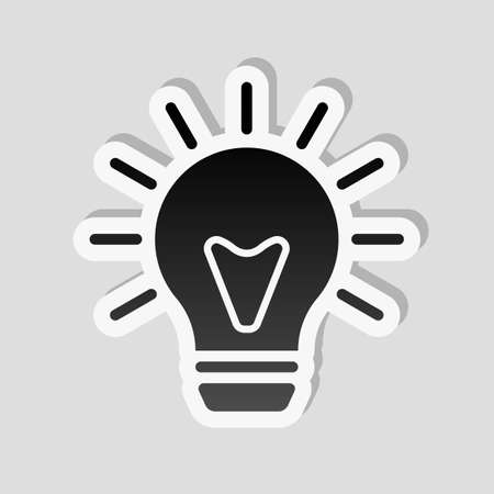 old bulb with light. simple single icon. Sticker style with white border and simple shadow on gray backgroundのイラスト素材